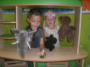 image of children playing with puppets